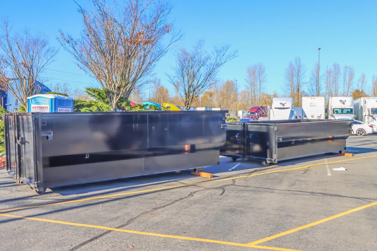 Professional dumpster rental service with roll-off container on residential driveway in Toronto